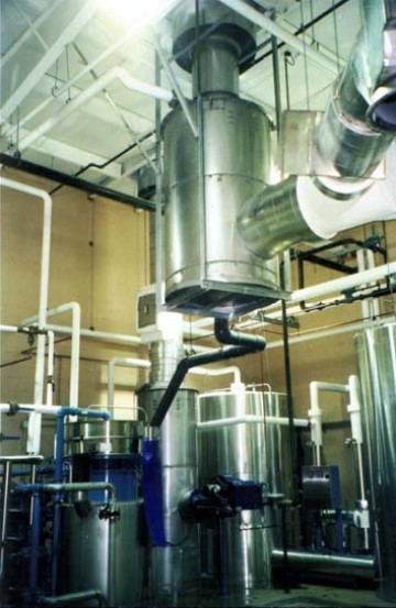 Stack economizer installed in industrial facility