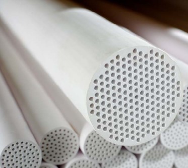 Perforated ceramic filter tubes showing detailed hole patterns
